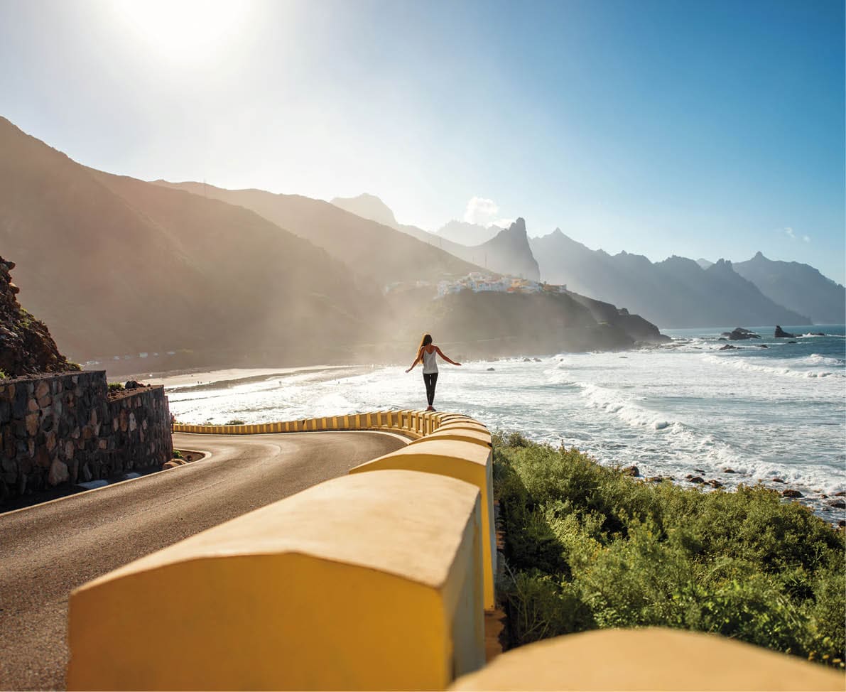 Woman walking near the mountain road near Taganana village on Tenerife island