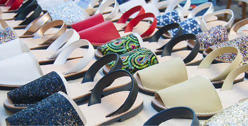 Typical Spanish shoes selling at a market along a street