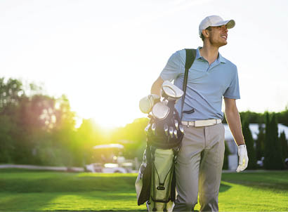 Young man playing golf outdoors
