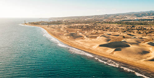 Aerial Maspalomas dunes view on Gran Canaria island near famous RIU hotel.