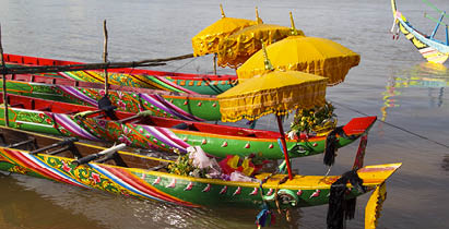 Racing boats with traditional decoration at the Water Festival in Phnom Penh, Cambodia in 2010.