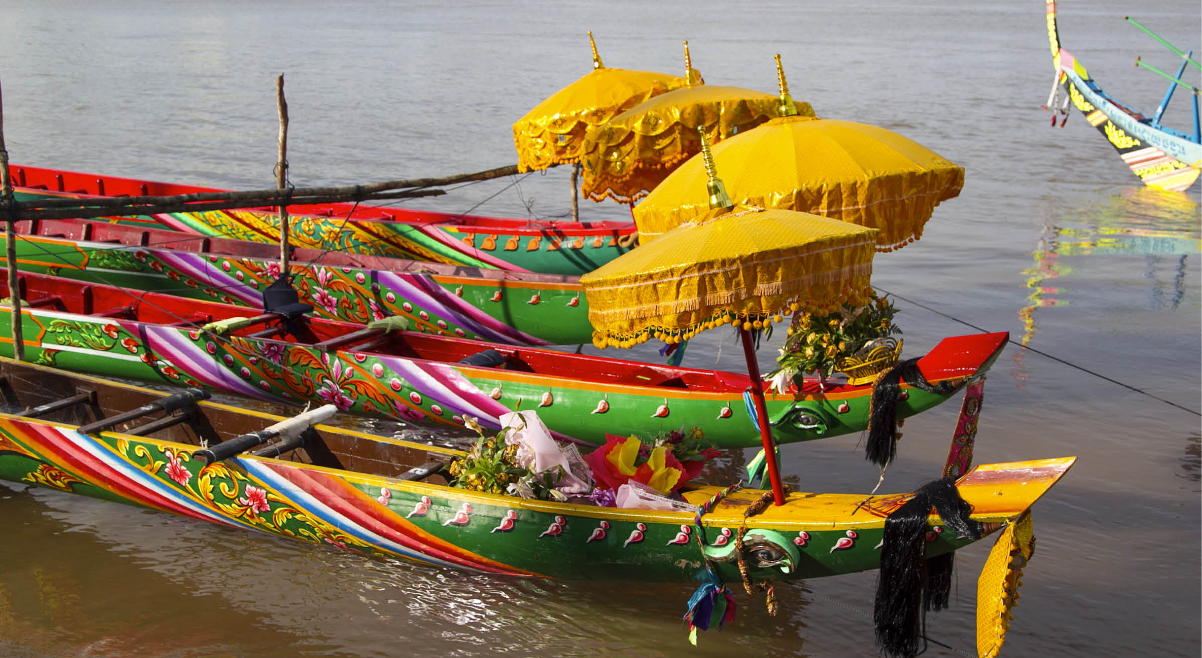 Racing boats with traditional decoration at the Water Festival in Phnom Penh, Cambodia in 2010.