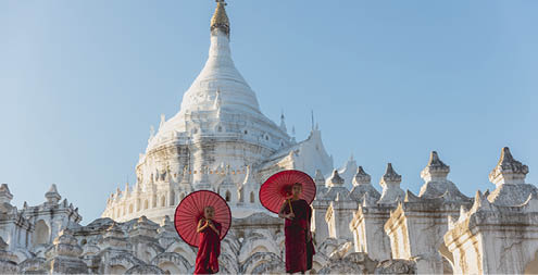 Novices under umbrellas at historic temple, Mingun, Mandalay, Myanmar