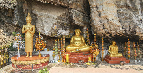 Golden buddha statues in a shrine on Mount Phousi in Laung Prabang - Laos