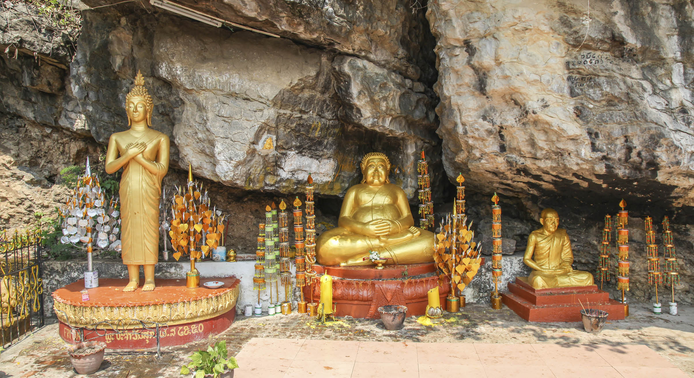 Golden buddha statues in a shrine on Mount Phousi in Laung Prabang - Laos