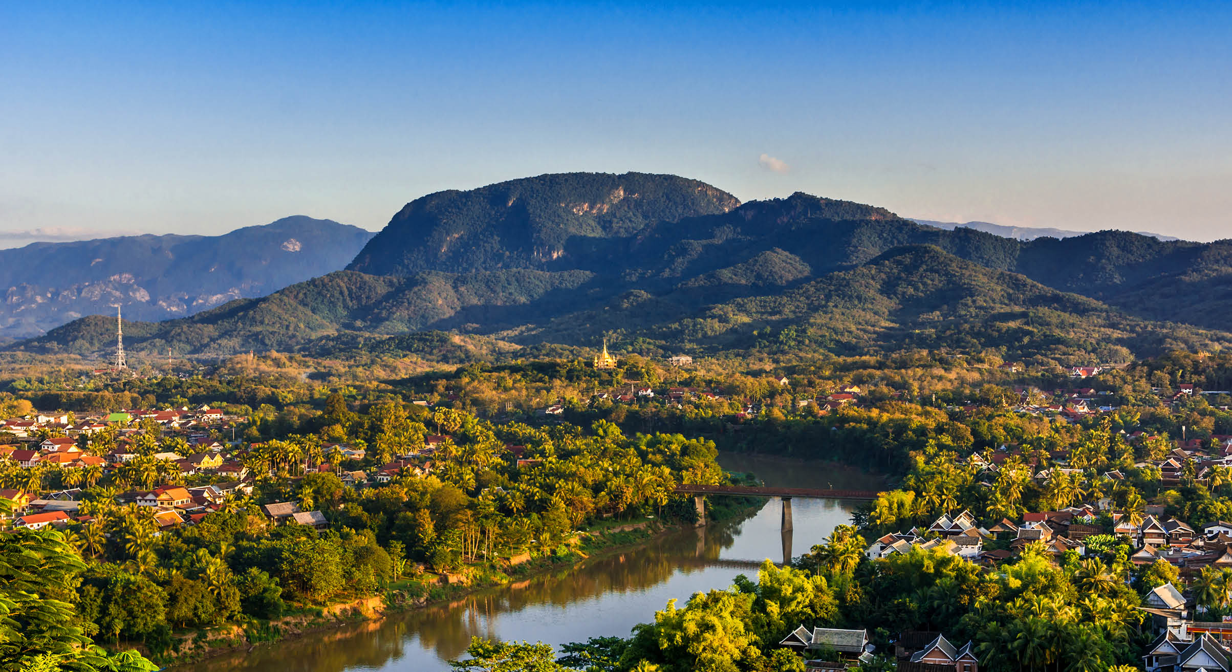 Luang Prabang, Laos, Southeast Asia: Landscape view over the city in the sunset lights from Mount Phousi, a sacred mountain located in the heart of the former capital of Laos