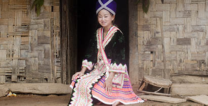 Asian woman Laos in traditional clothes, Hmong, in a Hmong village near Vang Vieng