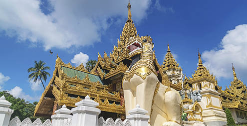 Golden ornamental south entrance gate with huge dragon statues to the famous Shwedagon Pagoda (Stupa) in downtown Yangon (Rangoon), Myanmar, Asia