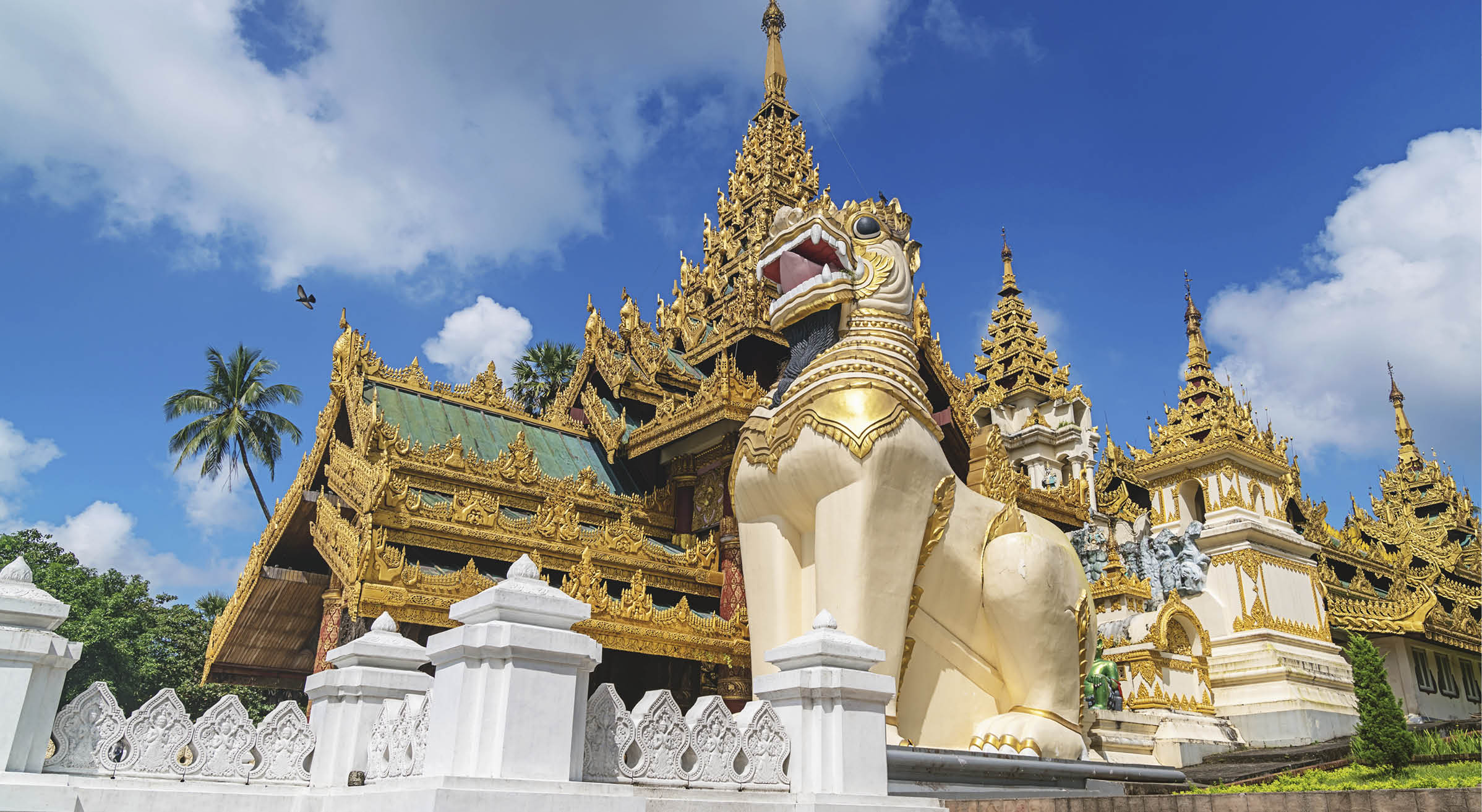 Golden ornamental south entrance gate with huge dragon statues to the famous Shwedagon Pagoda (Stupa) in downtown Yangon (Rangoon), Myanmar, Asia