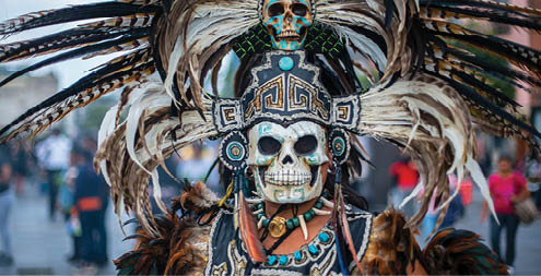 dancer characterized with prehispanic costumes in the zocalo of Mexico City