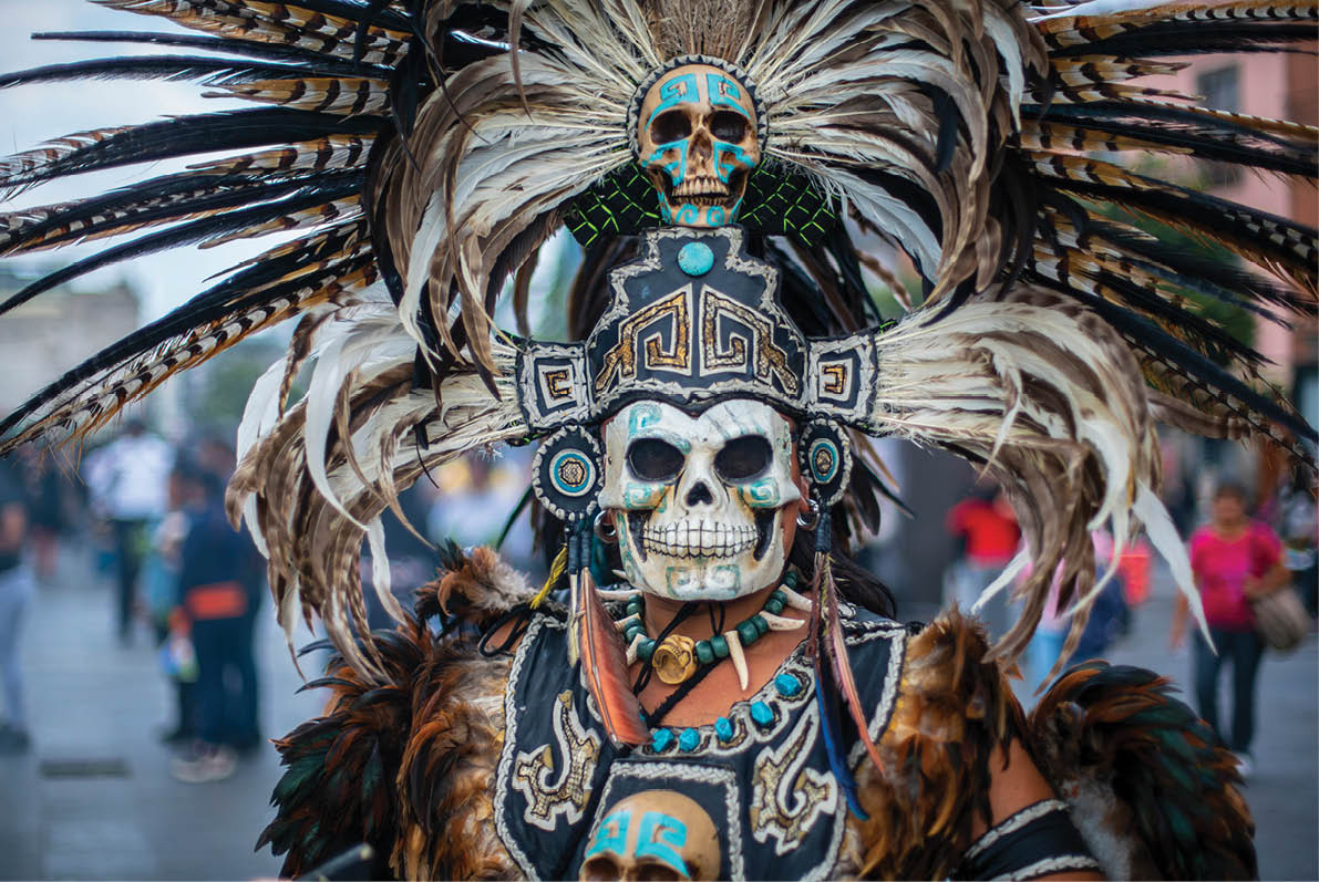 dancer characterized with prehispanic costumes in the zocalo of Mexico City