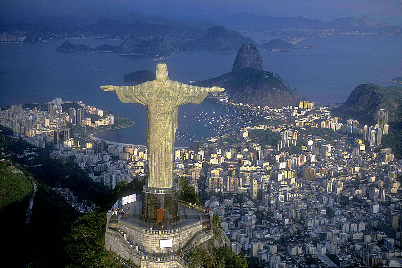 Rio de Janeiro, RJ, Brazil: Aerial view of Christ, symbol of Rio de Janeiro, standing on top of Corcovado Hill, overlooking Guanabara Bay