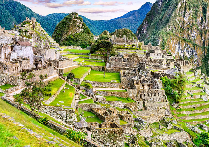 Machu Picchu in Peru - Ruins of Inca Empire city and Huaynapicchu Mountain in Sacred Valley, Cusco, South America 