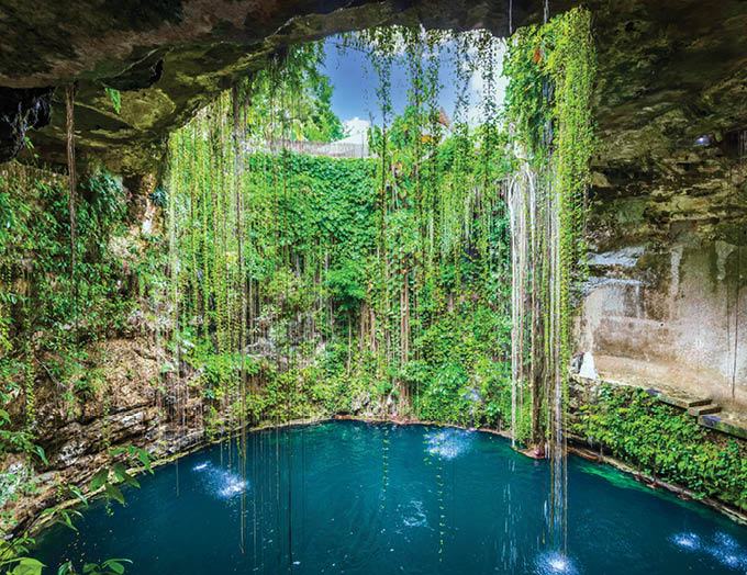 Ik-Kil Cenote, Mexico  Lovely cenote in Yucatan Peninsulla with transparent waters and hanging roots  Chichen Itza, Central America 