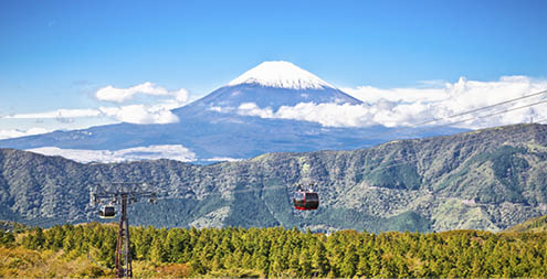 Ropeway and view of Mountain Fuji from Owakudani, Hakone. Japan.