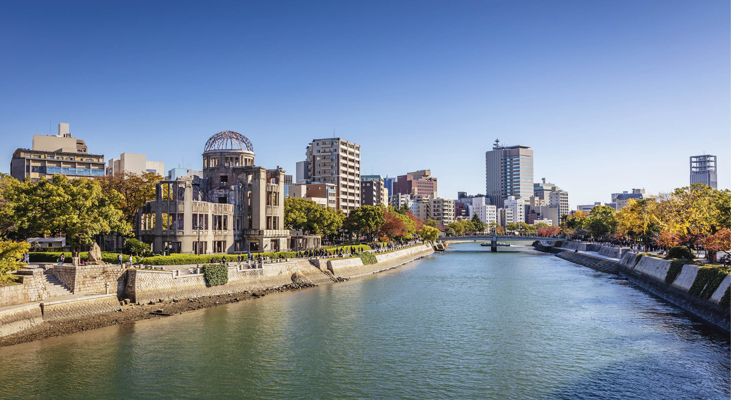 Hiroshima Cityscape on a Sunny Autumn Day. View over the Motoyasu River, Atomic Bomb Dome on the left side of the Motoyasu River. Naka Ward, Hiroshima, Japan, Asia.