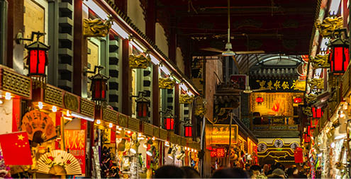 People visiting the Wangfujing Snack Street in Beijing. It is a night market with many stalls selling street snacks.,East Asia,Nikon D3x