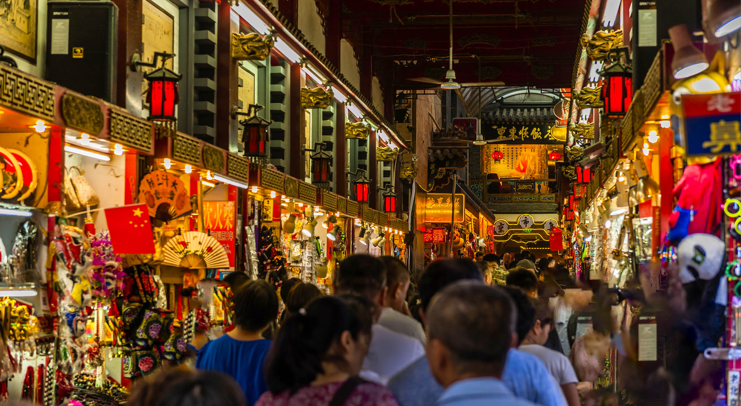 People visiting the Wangfujing Snack Street in Beijing. It is a night market with many stalls selling street snacks.,East Asia,Nikon D3x