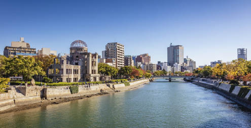 Hiroshima Cityscape on a Sunny Autumn Day. View over the Motoyasu River, Atomic Bomb Dome on the left side of the Motoyasu River. Naka Ward, Hiroshima, Japan, Asia.