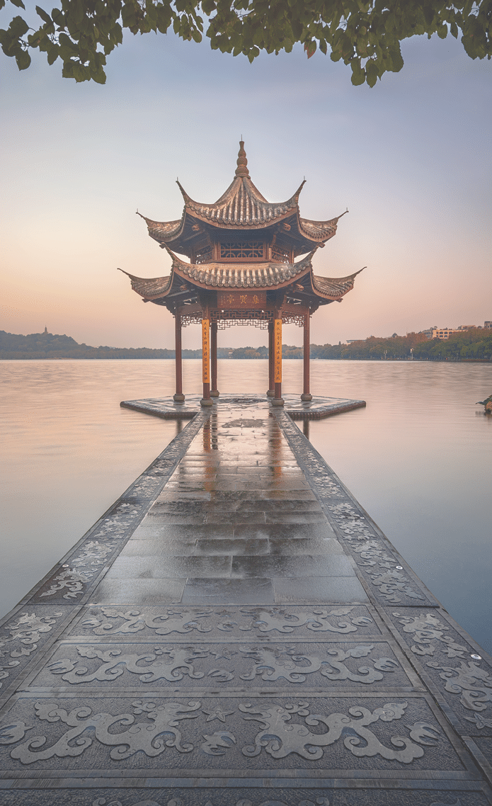 illuminated ancient Jixian Pavilion at West Lake, Hangzhou, China. All Chinese words only introduce itself which means Jixian Pavilion without advertisement.