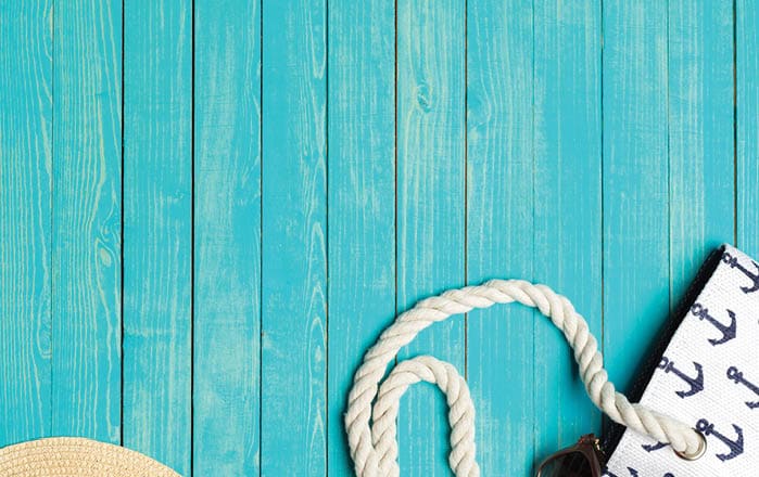 Beach accessories on wooden table 