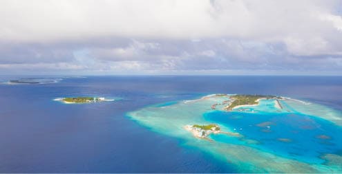 Aerial view on Maldives island, Raa atol