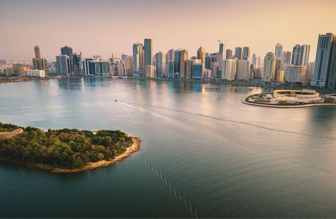 Emirate of Sharjah cityscape waterfront rising above Al Noor Island at city downtown in the United Arab Emirates