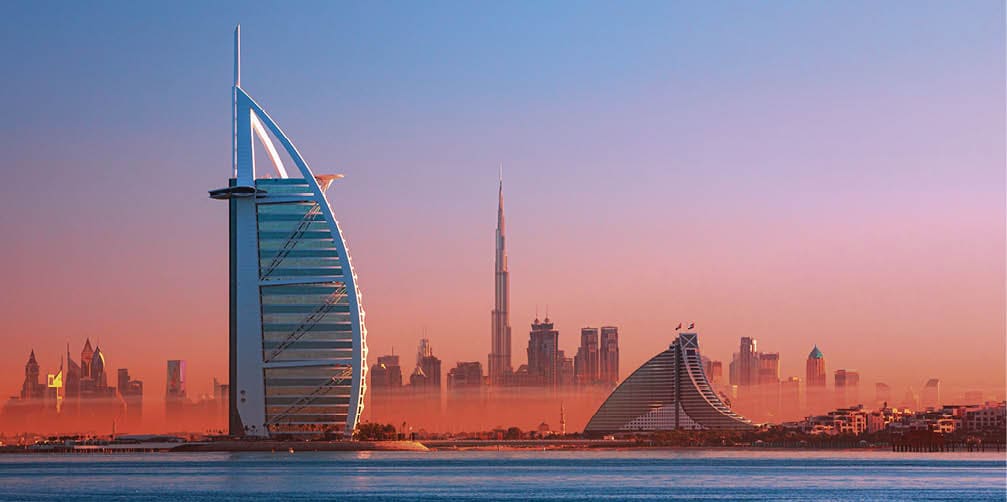 Dubai city - amazing city center skyline and famous Jumeirah beach at sunset, United Arab Emirates