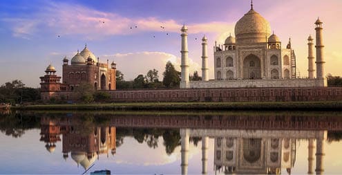 Taj Mahal is a white marble mausoleum on the banks of the Yamuna river built by Mughal Emperor Shah Jahan. A UNESCO World Heritage site at Agra, India. Photograph taken from Mehtab Bagh.