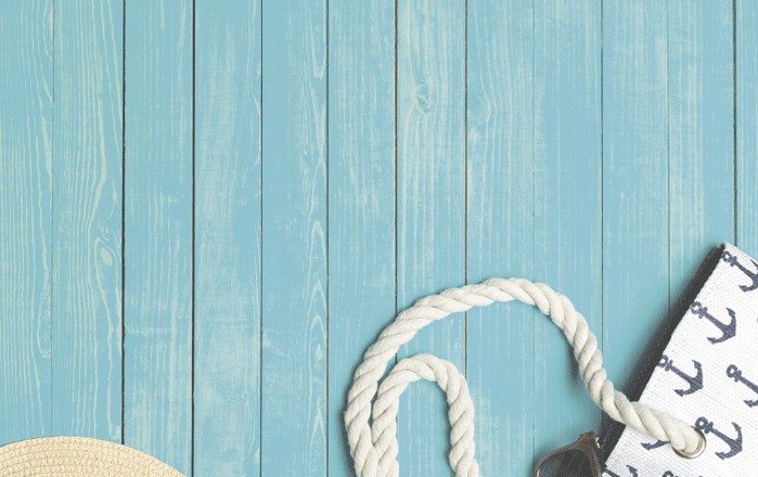 Beach accessories on wooden table.