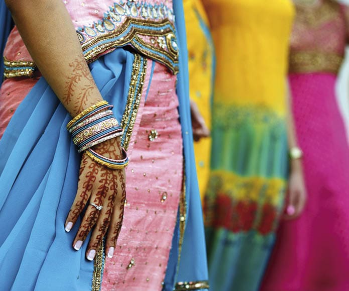 Image detail shot of henna tattoo and saris