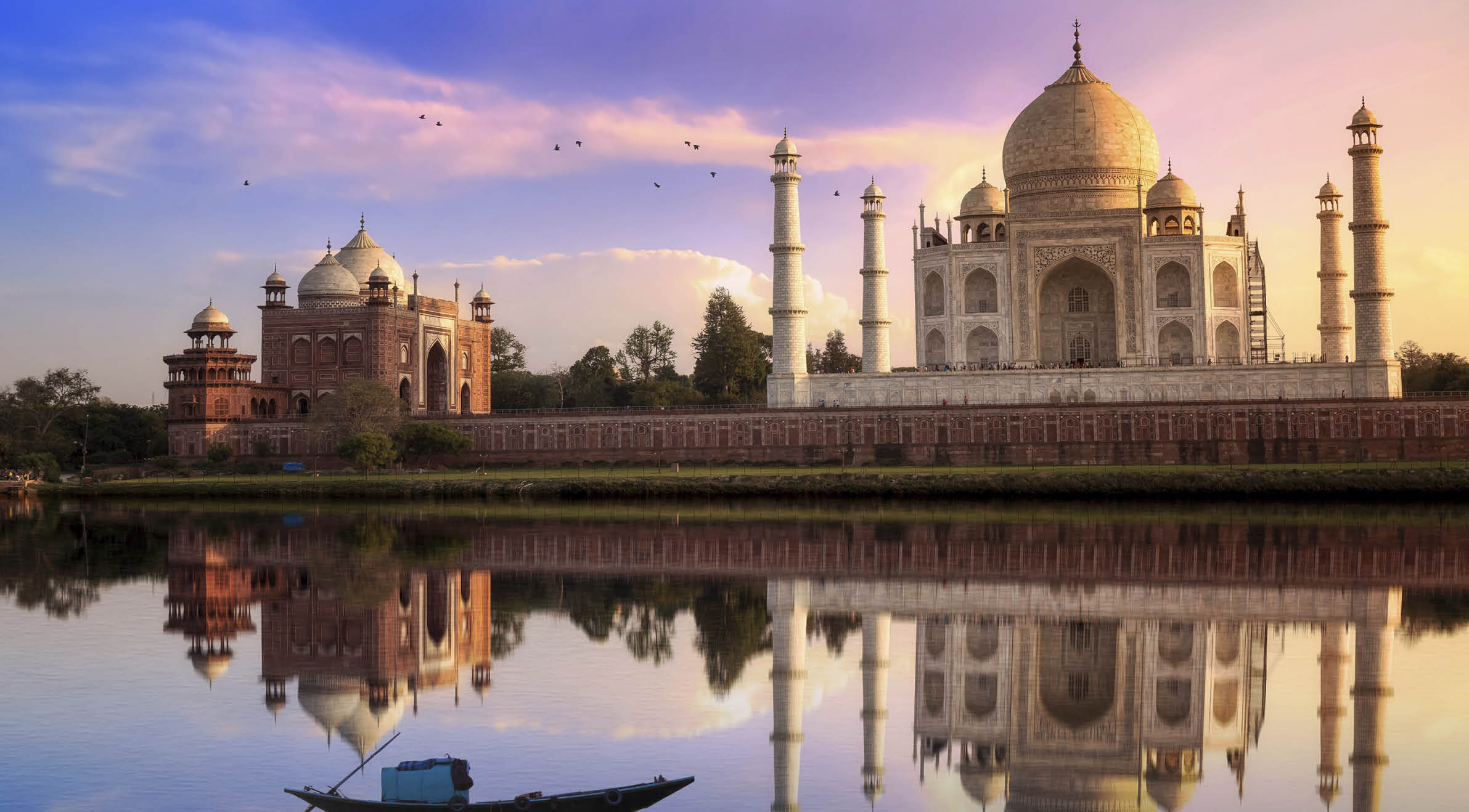 Taj Mahal is a white marble mausoleum on the banks of the Yamuna river built by Mughal Emperor Shah Jahan. A UNESCO World Heritage site at Agra, India. Photograph taken from Mehtab Bagh.