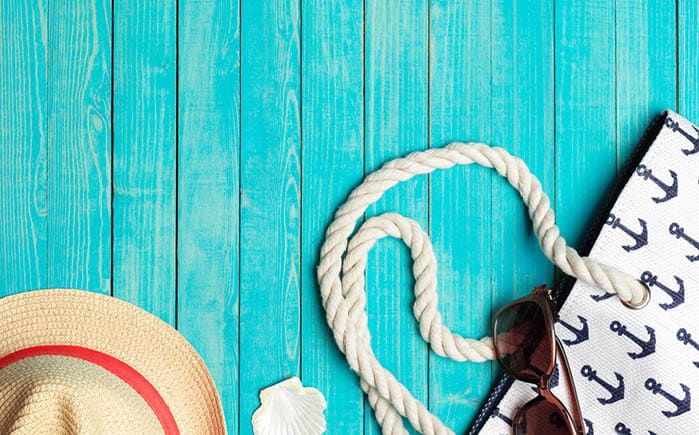 Beach accessories on wooden table.