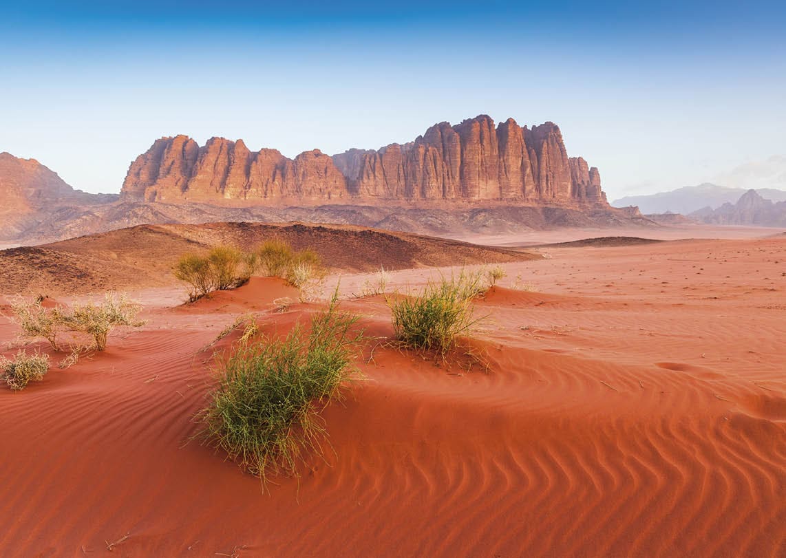 Wadi Rum Desert, Jordan. The red desert and Jabal Al Qattar mountain.