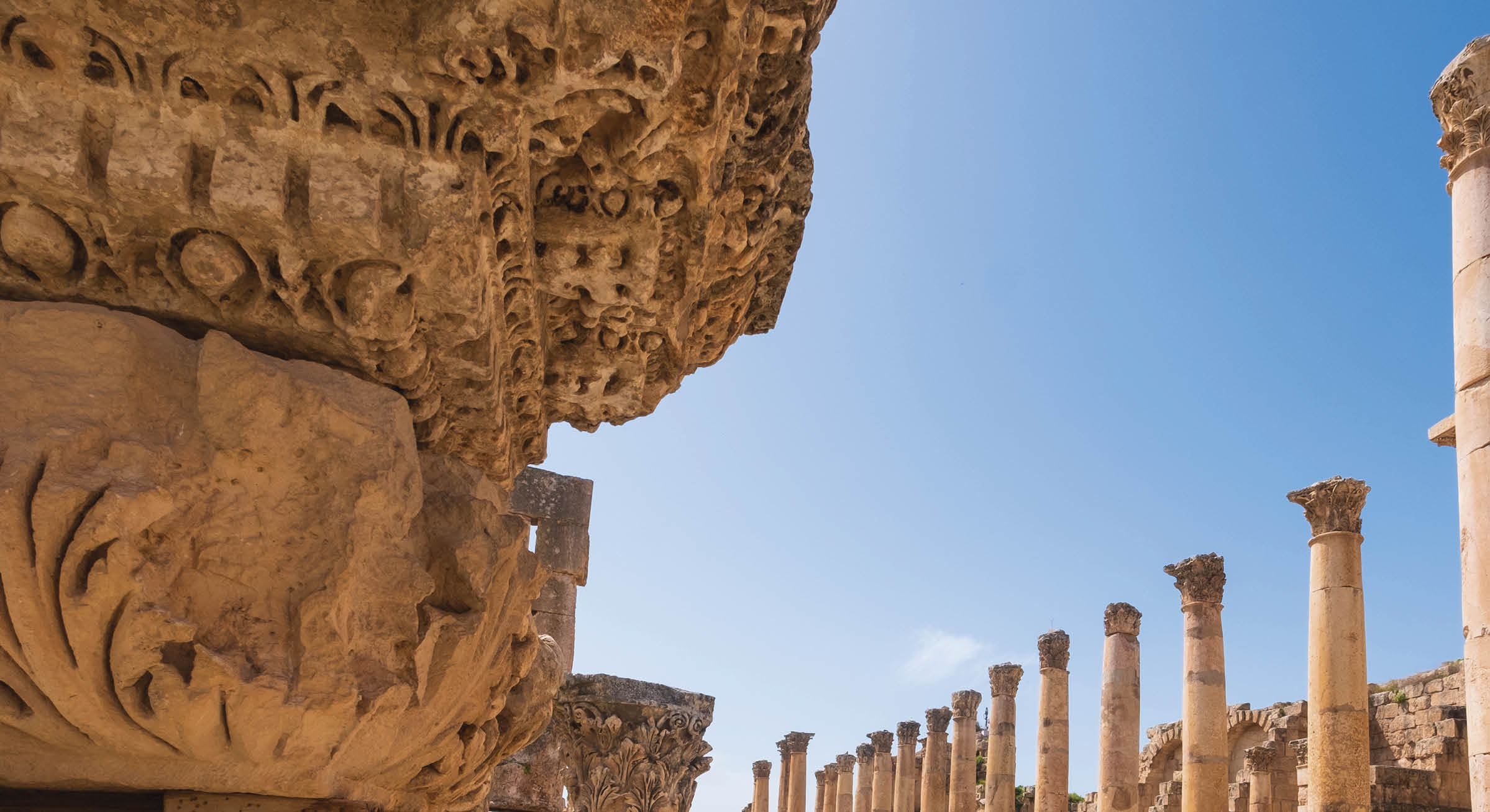 a stone ornament of column base on the ruins of the city of Jerash in Jordan in spring